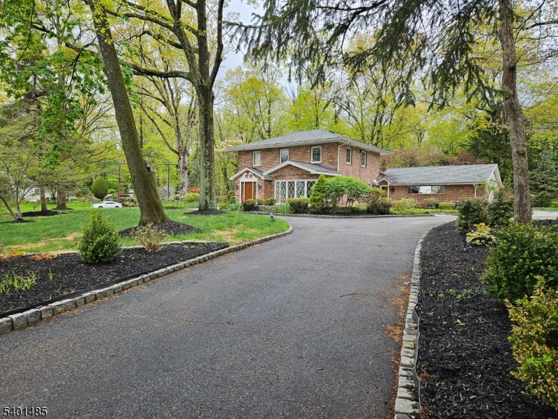 218 Devon Road Essex Fells, NJ 07021 - Photo 21 of 23 a front view of a house with garden