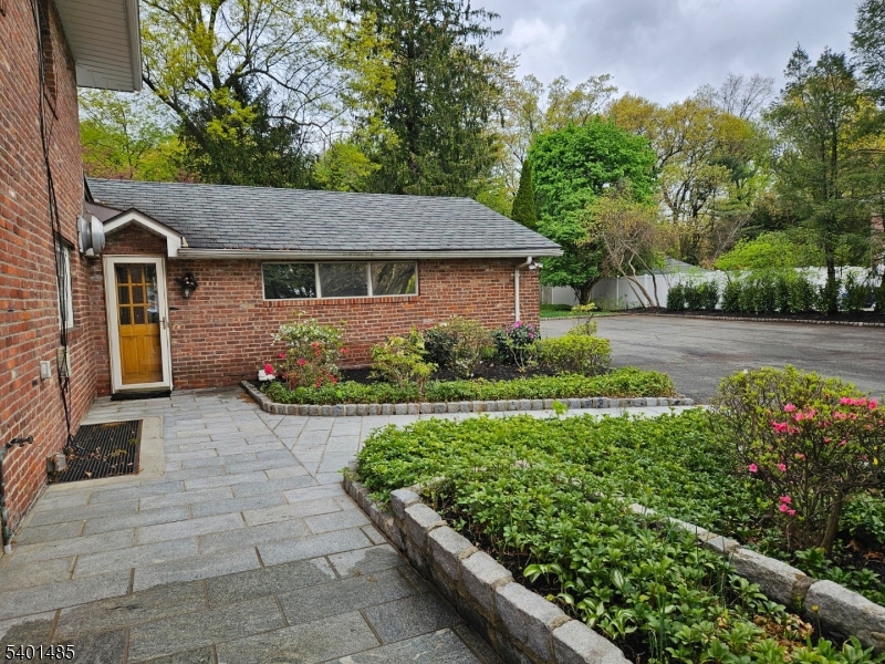 218 Devon Road Essex Fells, NJ 07021 - Photo 23 of 23 a front view of a house with garden