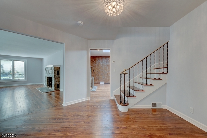 218 Devon Road Essex Fells, NJ 07021 - Photo 3 of 14 a view of entryway and hall with wooden floor