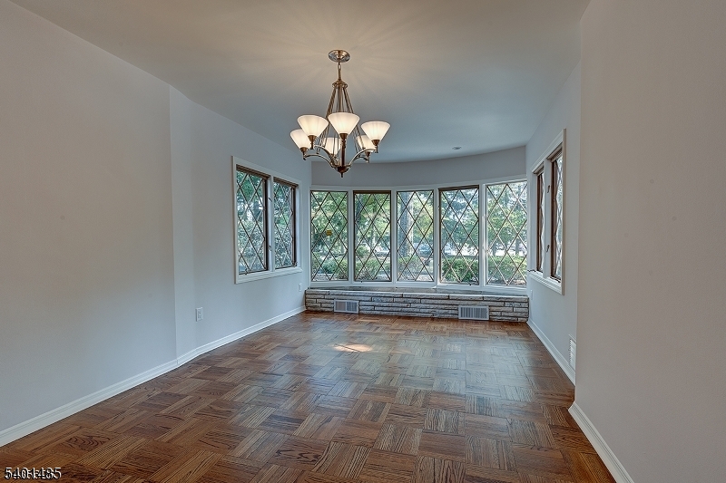 218 Devon Road Essex Fells, NJ 07021 - Photo 5 of 14 a view of livingroom with window ceiling fan and outdoor view