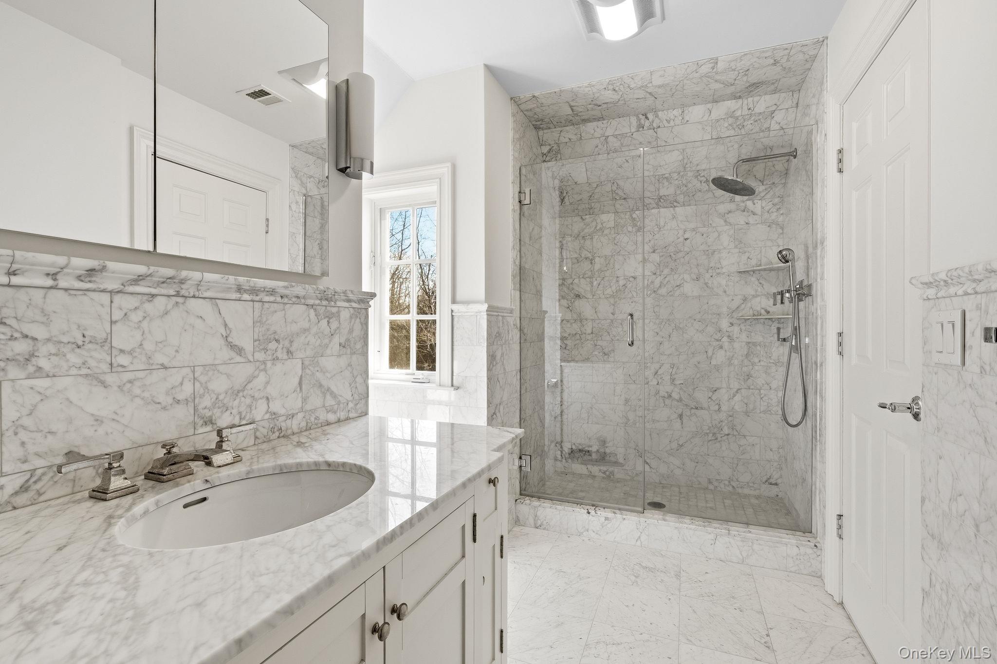 58 Old Logging Road Bedford, NY 10506 - Photo 26 of 34 a bathroom with a sink and a shower