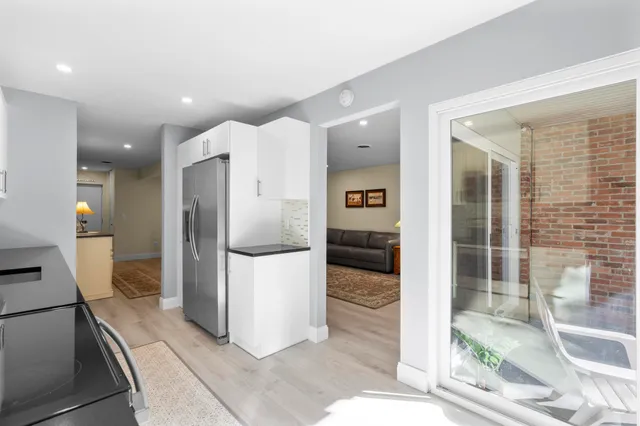 a kitchen with appliances a sink and cabinets