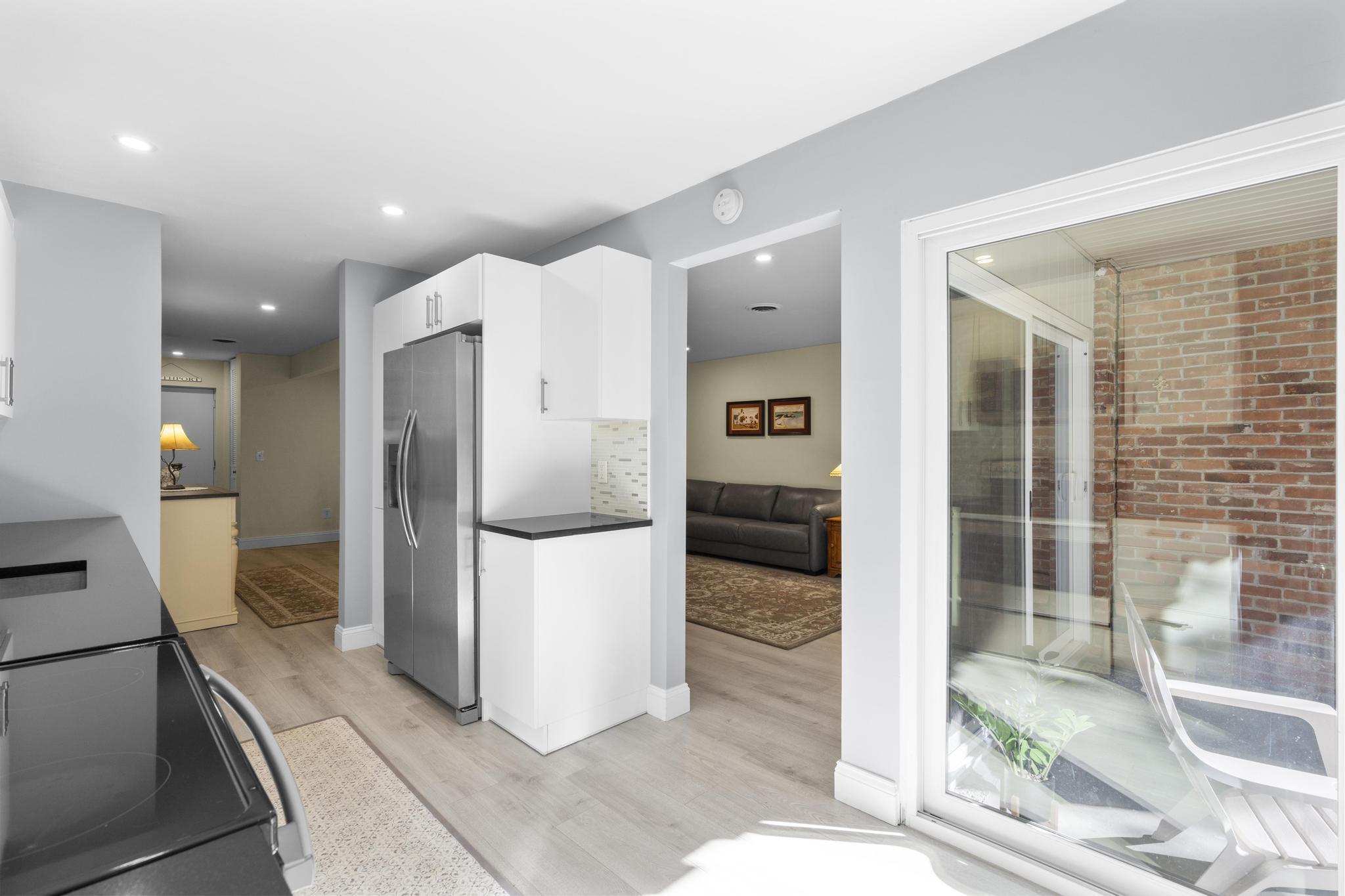 28 Mill Hill Road, Unit 28 Fairfield, CT 06890 - Photo 18 of 37 a kitchen with a refrigerator and a sink