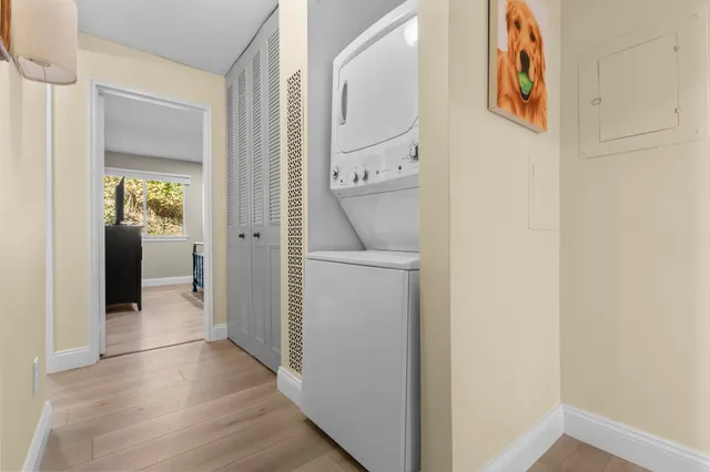 a spacious bedroom with a bed and a large window