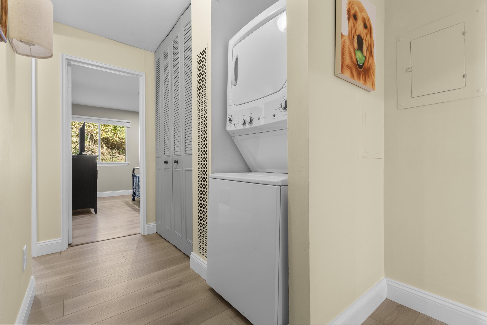 28 Mill Hill Road, Unit 28 Fairfield, CT 06890 - Photo 20 of 37 a view of a hallway with wooden floor and a bathroom