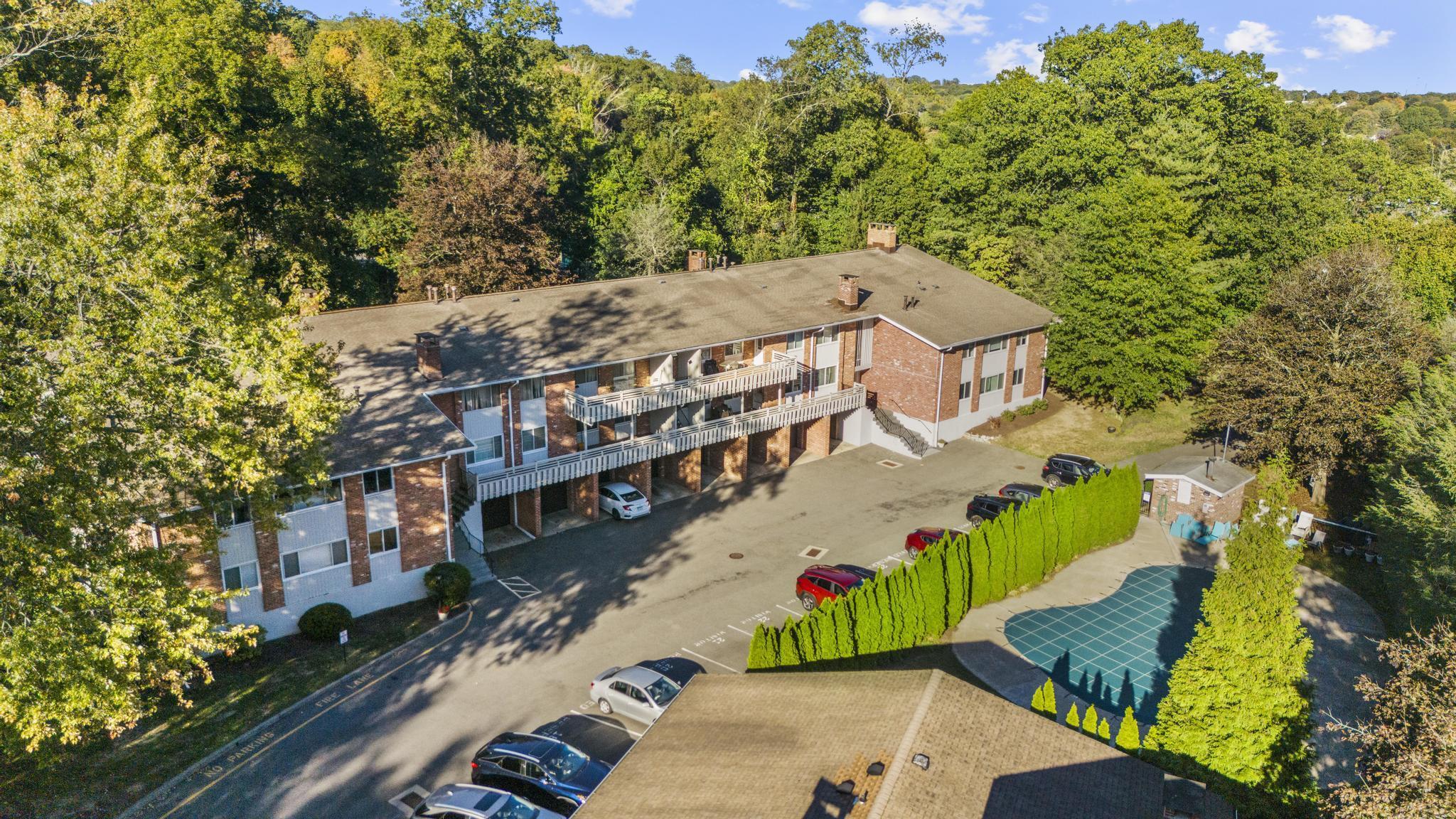 28 Mill Hill Road, Unit 28 Fairfield, CT 06890 - Photo 2 of 37 an aerial view of a house