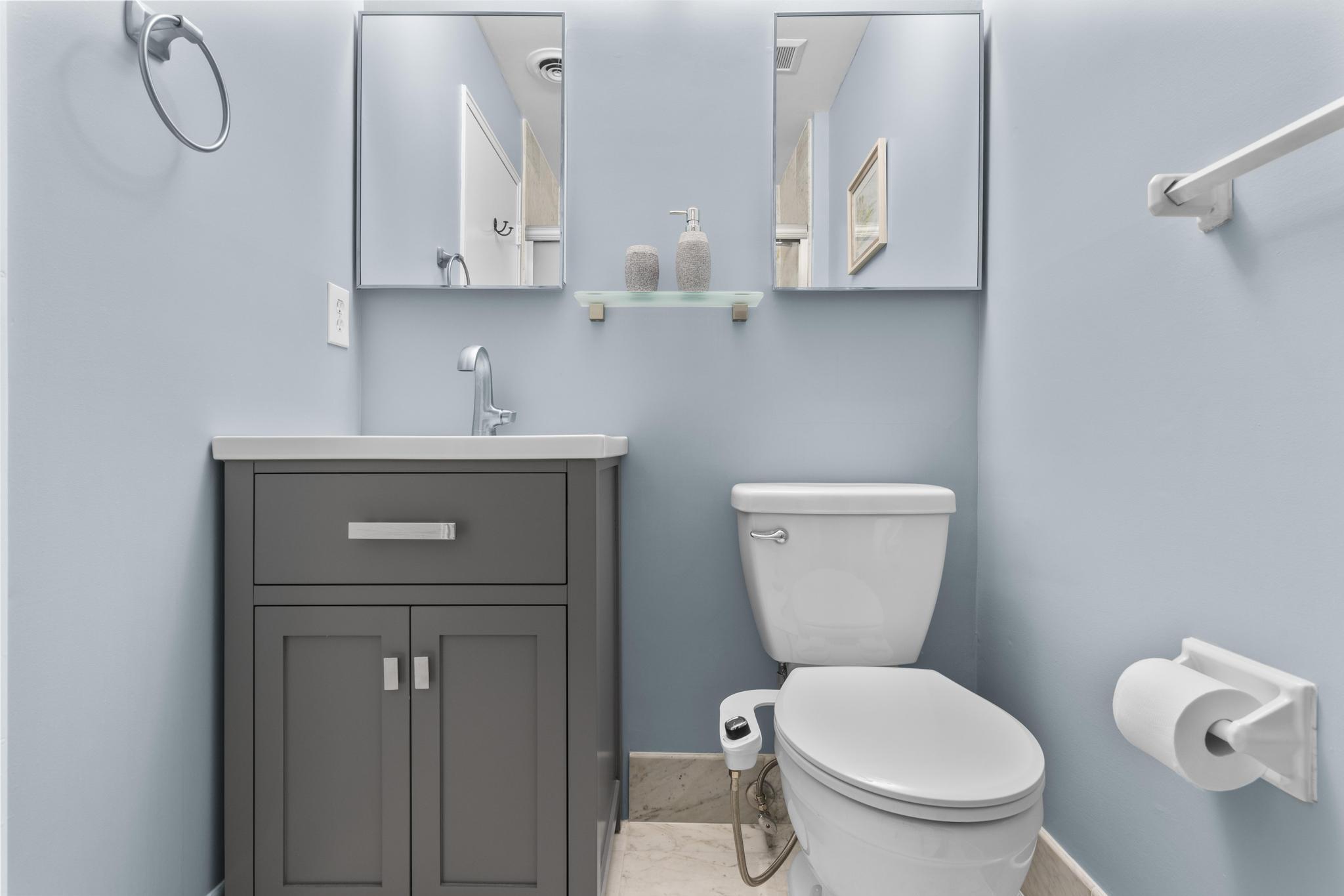 28 Mill Hill Road, Unit 28 Fairfield, CT 06890 - Photo 23 of 37 a bathroom with a toilet sink and mirror