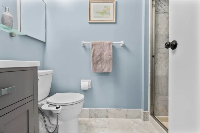 a living room with furniture a table and a large window