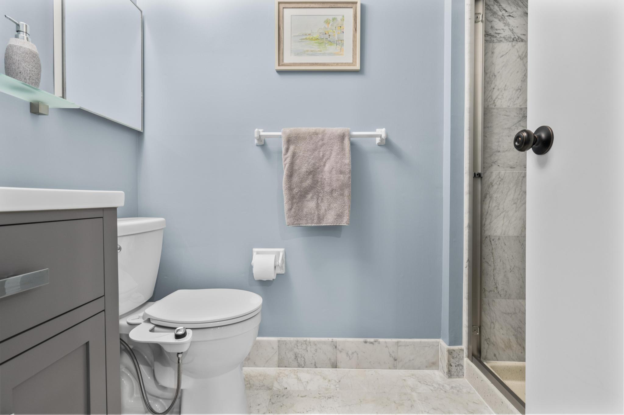 28 Mill Hill Road, Unit 28 Fairfield, CT 06890 - Photo 24 of 37 a white toilet sitting next to a bathroom sink