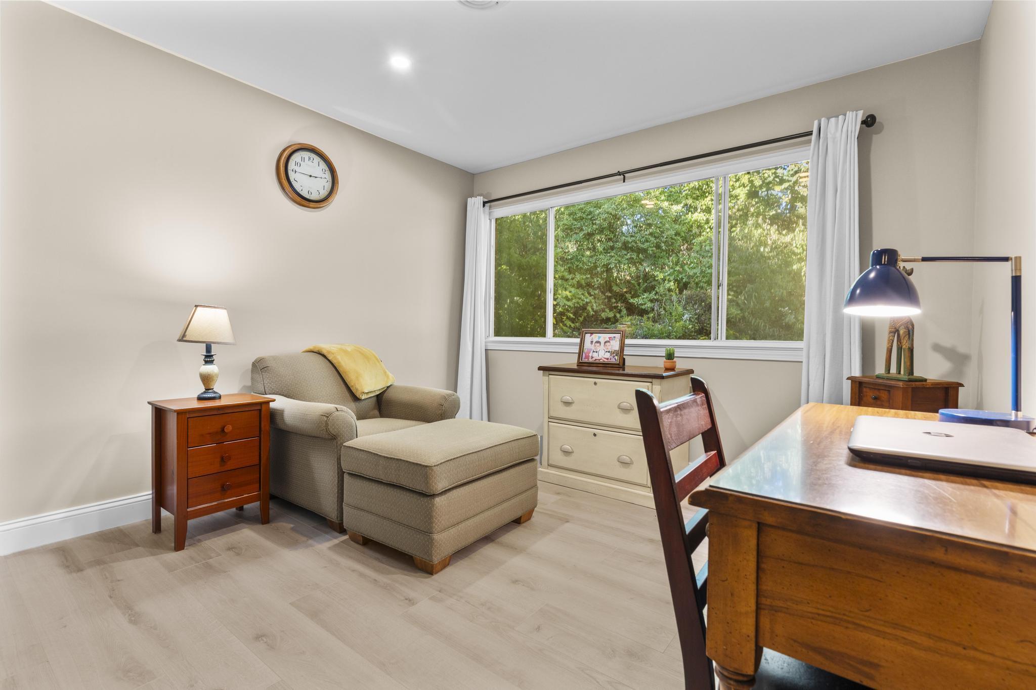 28 Mill Hill Road, Unit 28 Fairfield, CT 06890 - Photo 25 of 37 a living room with furniture a table and a large window