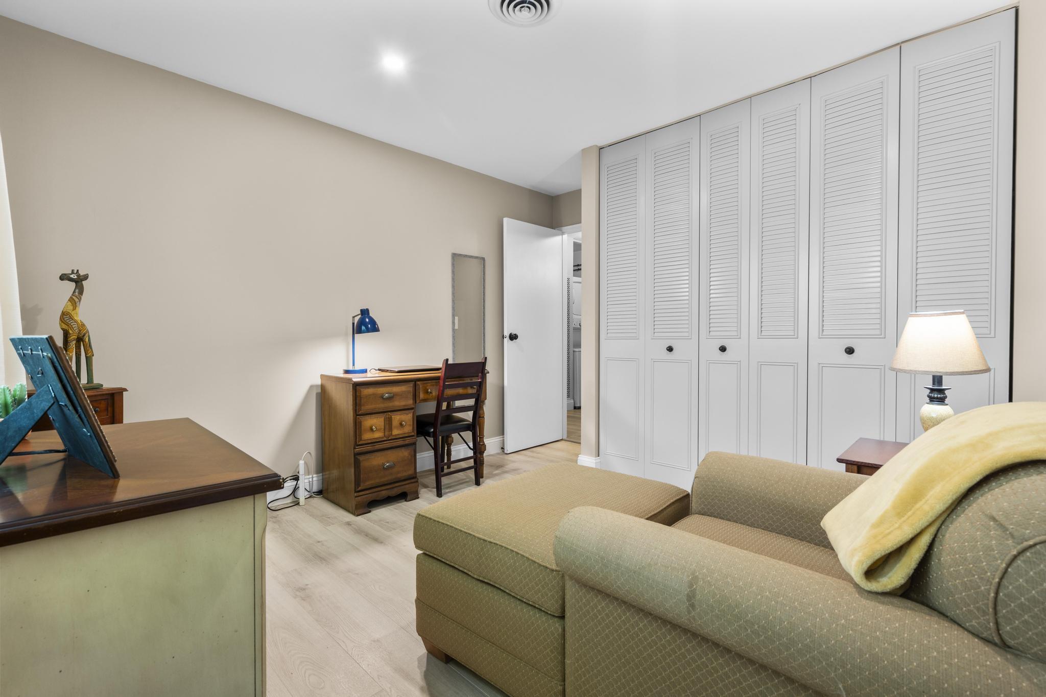 28 Mill Hill Road, Unit 28 Fairfield, CT 06890 - Photo 26 of 37 a living room with furniture and a table