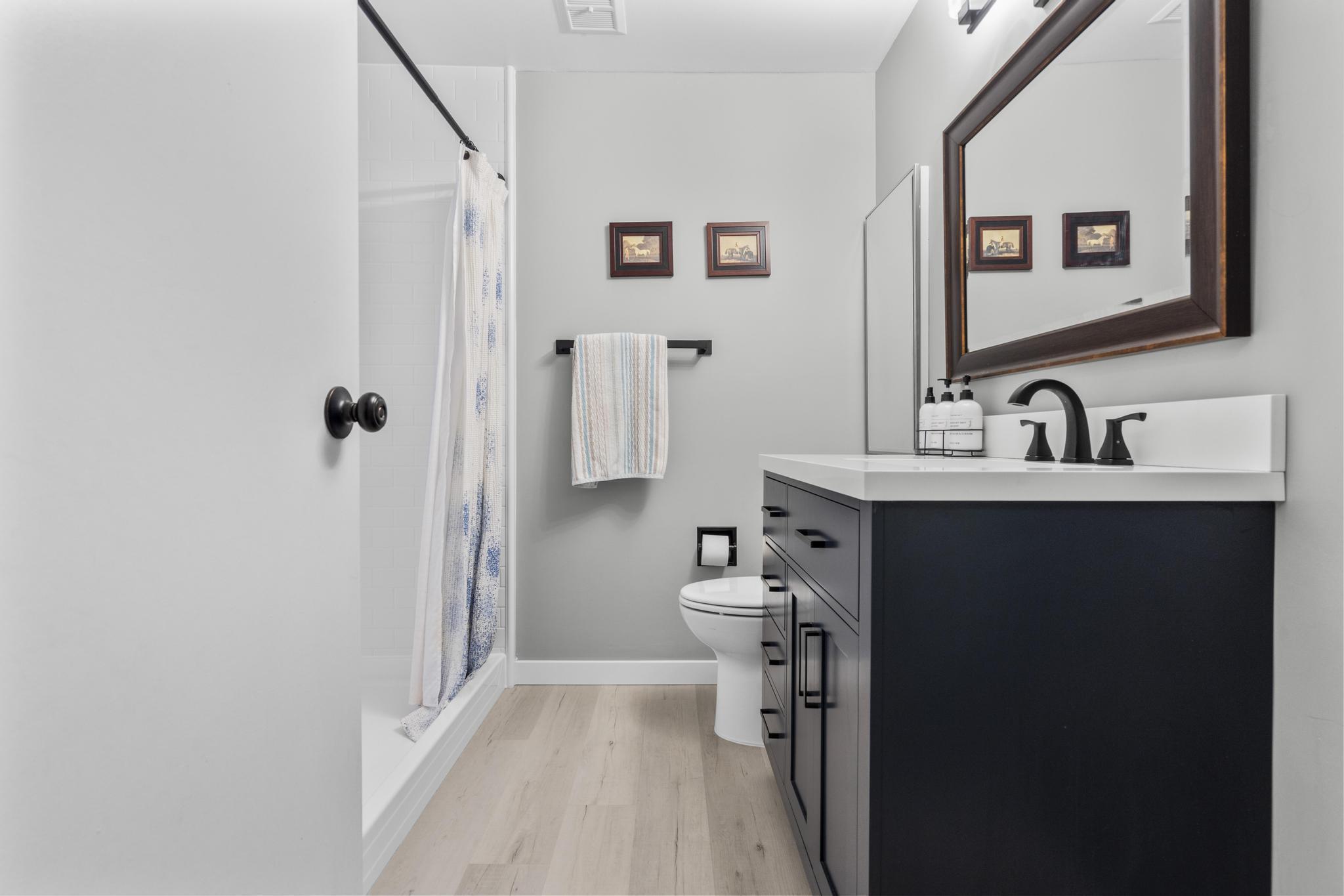 28 Mill Hill Road, Unit 28 Fairfield, CT 06890 - Photo 28 of 37 a bathroom with a sink toilet and shower