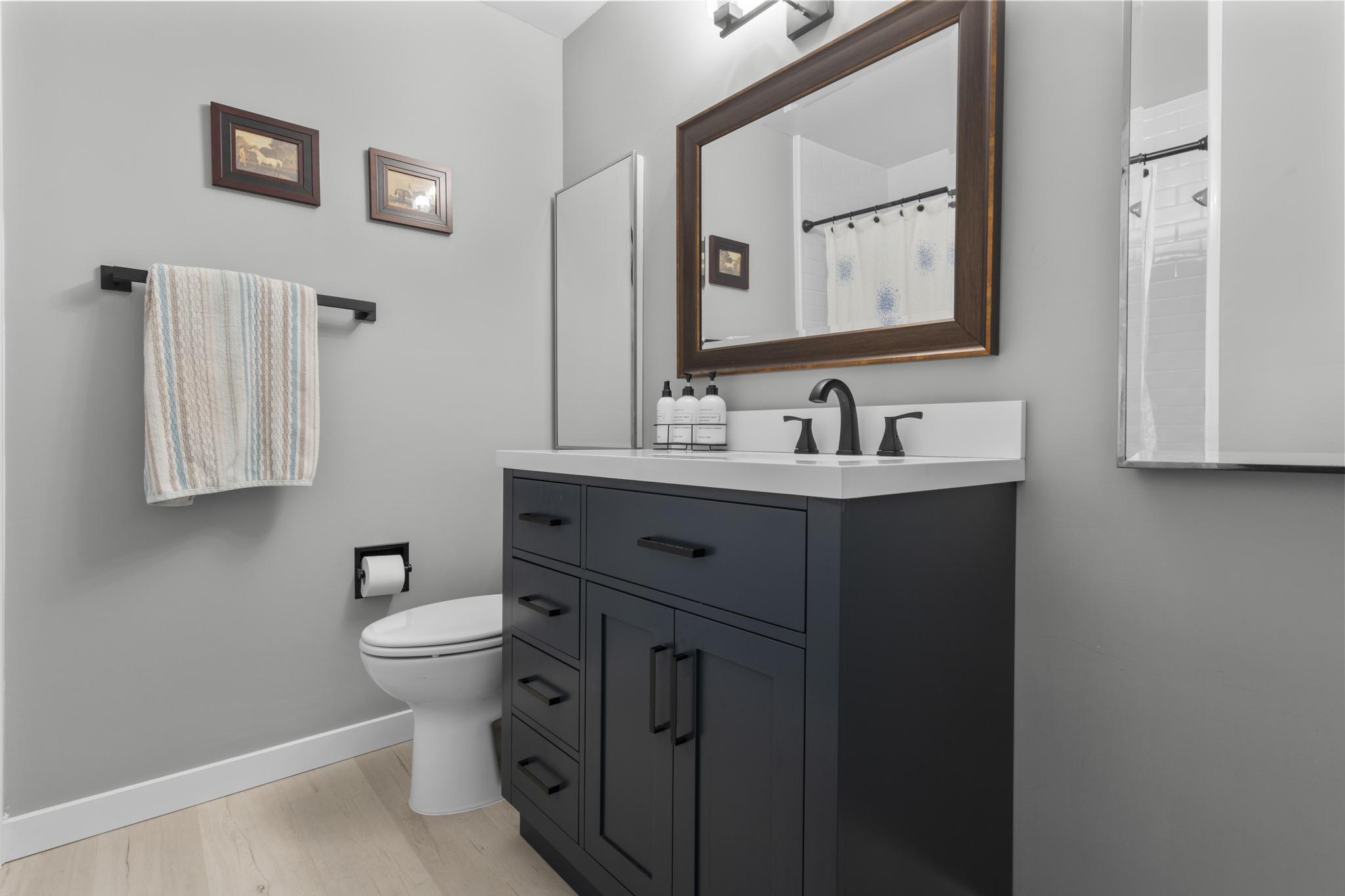 28 Mill Hill Road, Unit 28 Fairfield, CT 06890 - Photo 29 of 37 a bathroom with a toilet sink and mirror