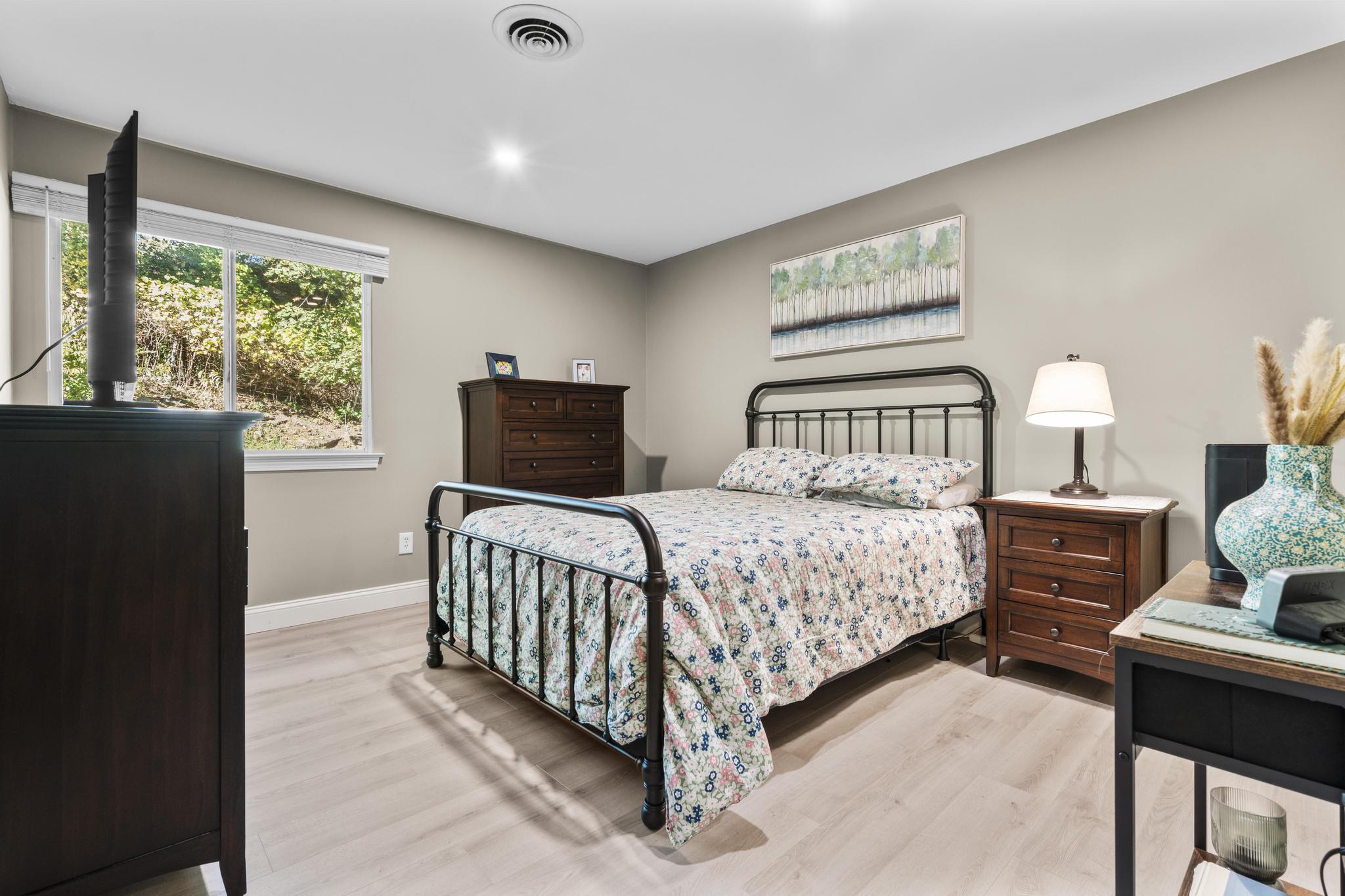 28 Mill Hill Road, Unit 28 Fairfield, CT 06890 - Photo 31 of 37 a bedroom with a bed and window