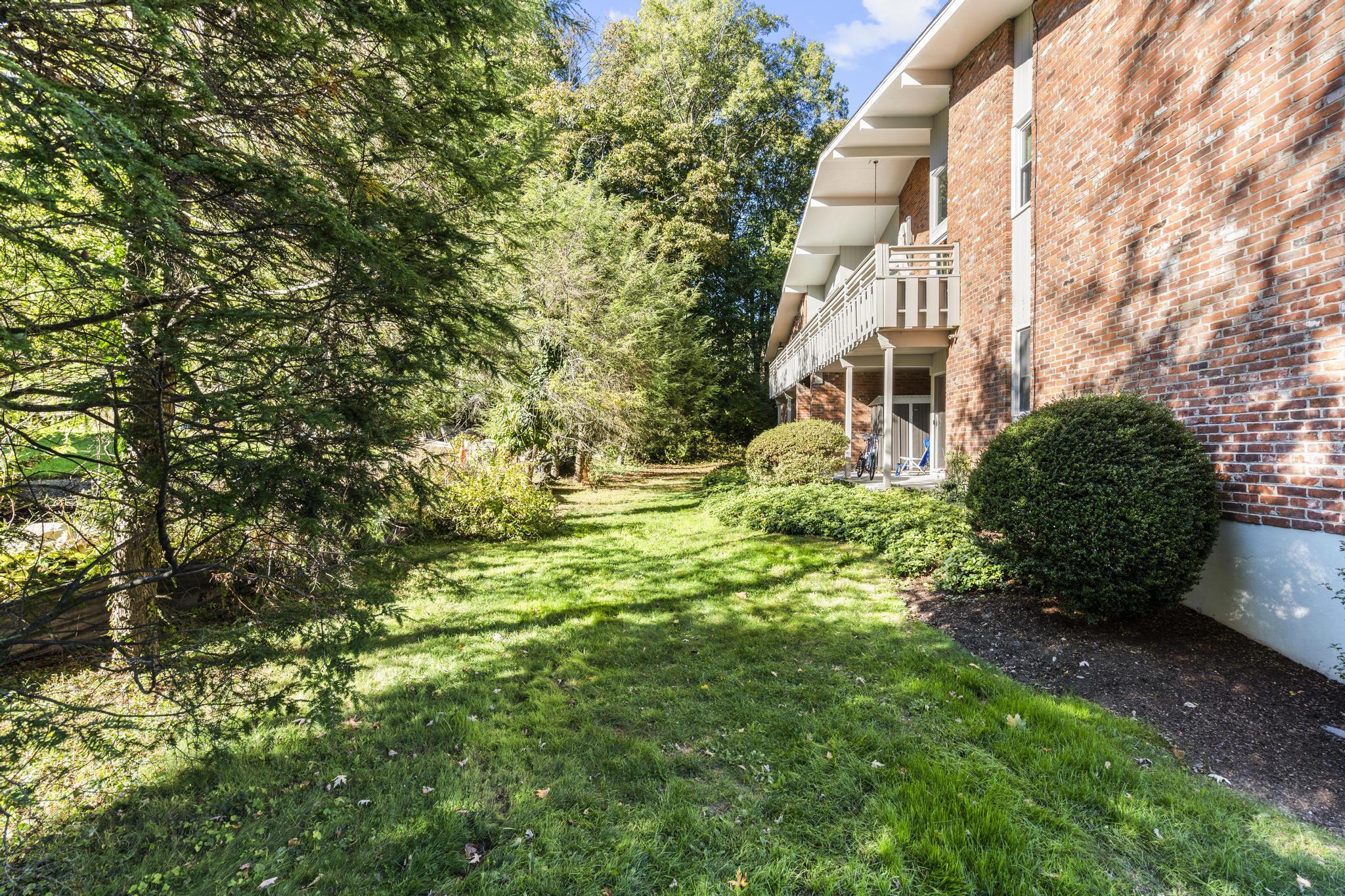 28 Mill Hill Road, Unit 28 Fairfield, CT 06890 - Photo 34 of 37 a view of a house with a yard