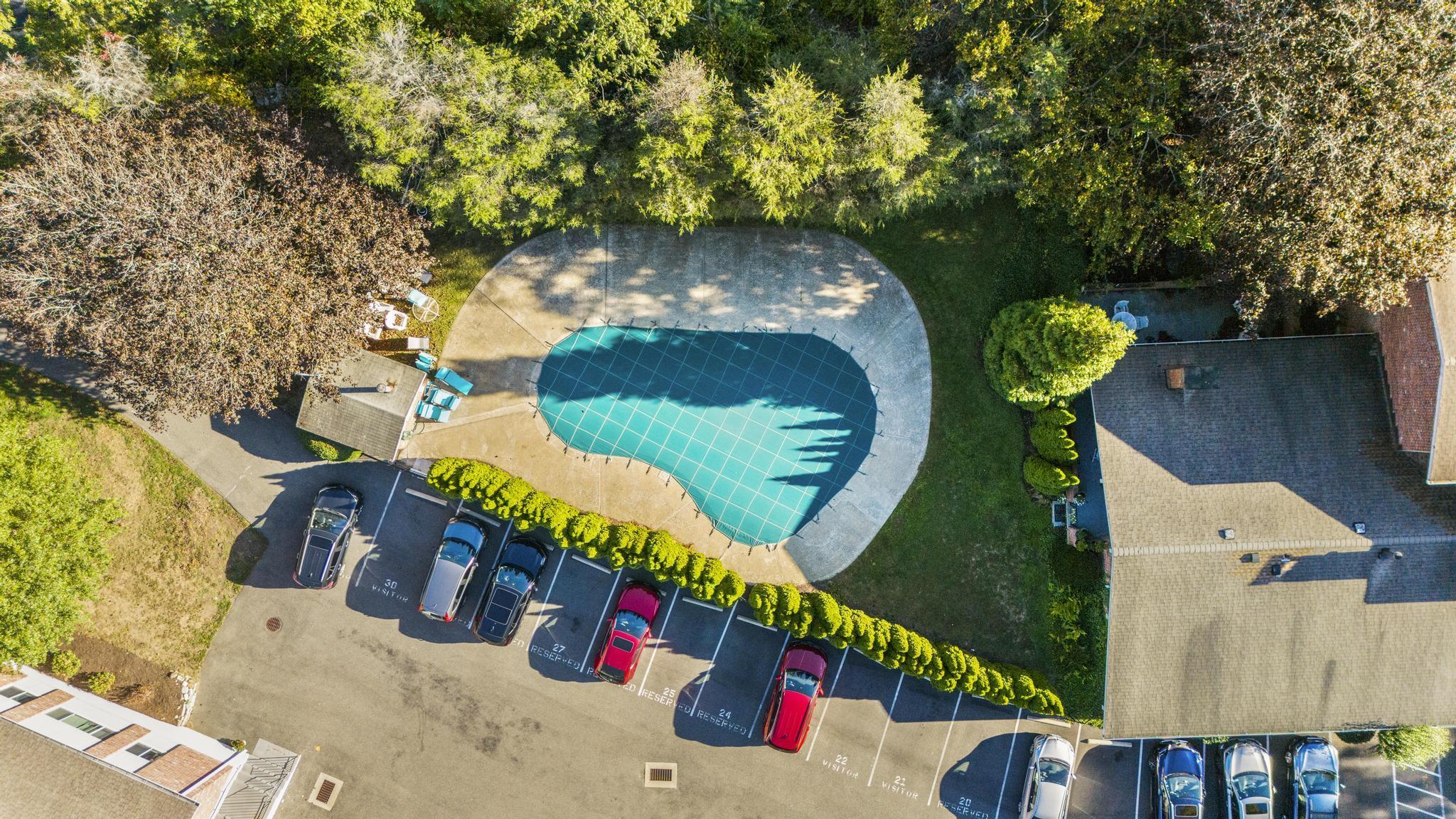 28 Mill Hill Road, Unit 28 Fairfield, CT 06890 - Photo 6 of 37 an aerial view of a house with a swimming pool