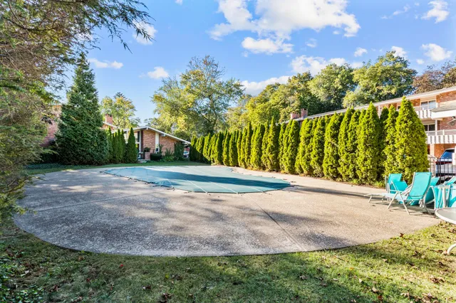 a view of a street with a building in the background