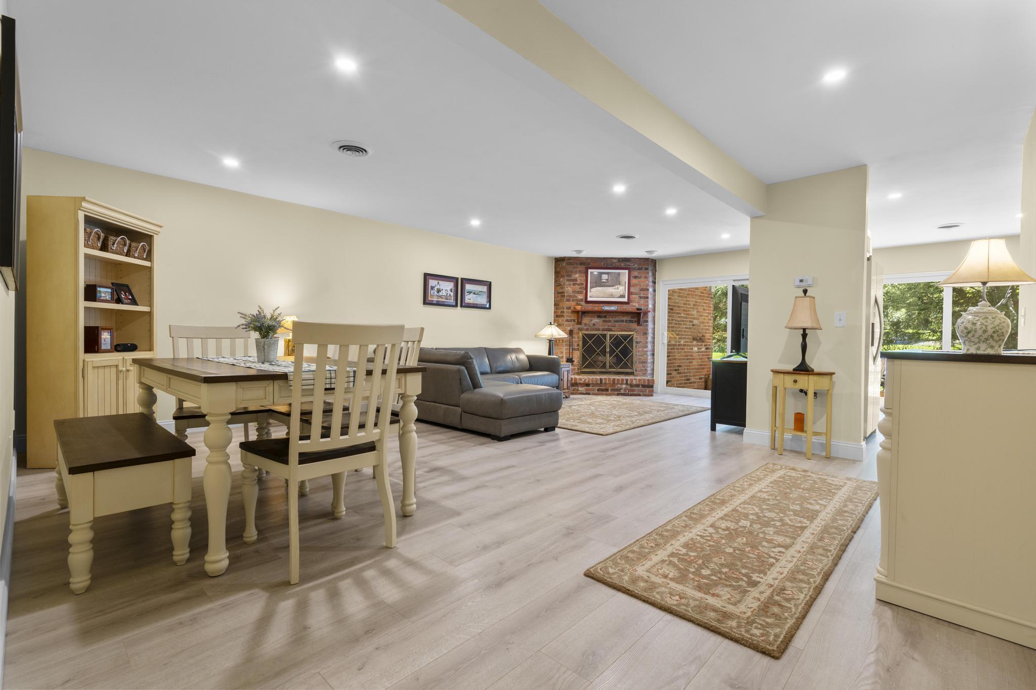 28 Mill Hill Road, Unit 28 Fairfield, CT 06890 - Photo 10 of 37 a living room with furniture and a rug