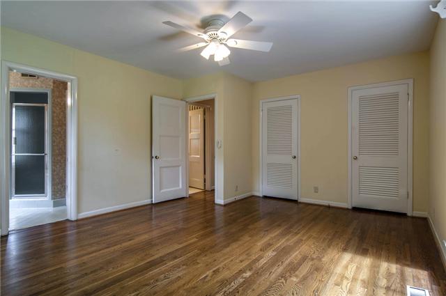 5958 Post Road Nashville, TN 37205 - Photo 10 of 20 Spacious master bedroom with en-suite bath. Hardwoods, ceiling fan and view of the yard