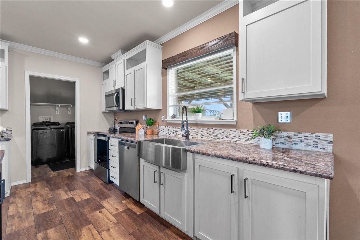 8710 Fm 646 Road South Santa Fe, TX 77510 - Photo 9 of 32 The roomy kitchen offers ample cabinet space, making organization and storage a breeze
