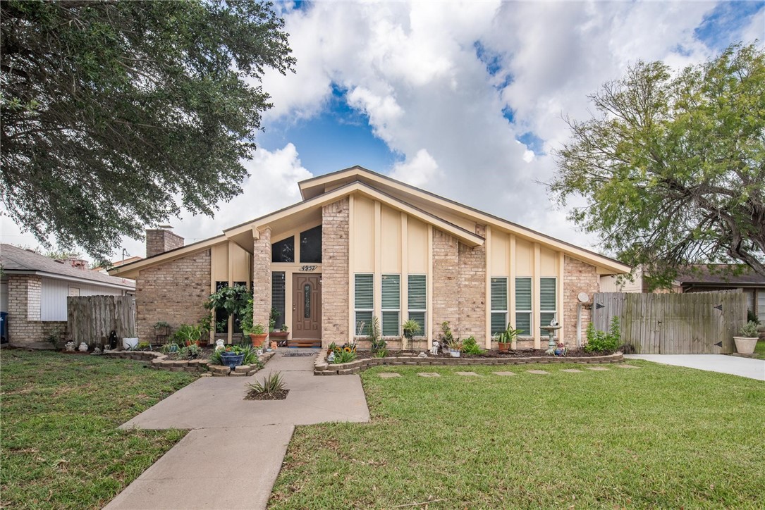 4957 Shadowbend Drive Corpus Christi, TX 78413 - Photo 16 of 35 a view of a house with backyard and a tree
