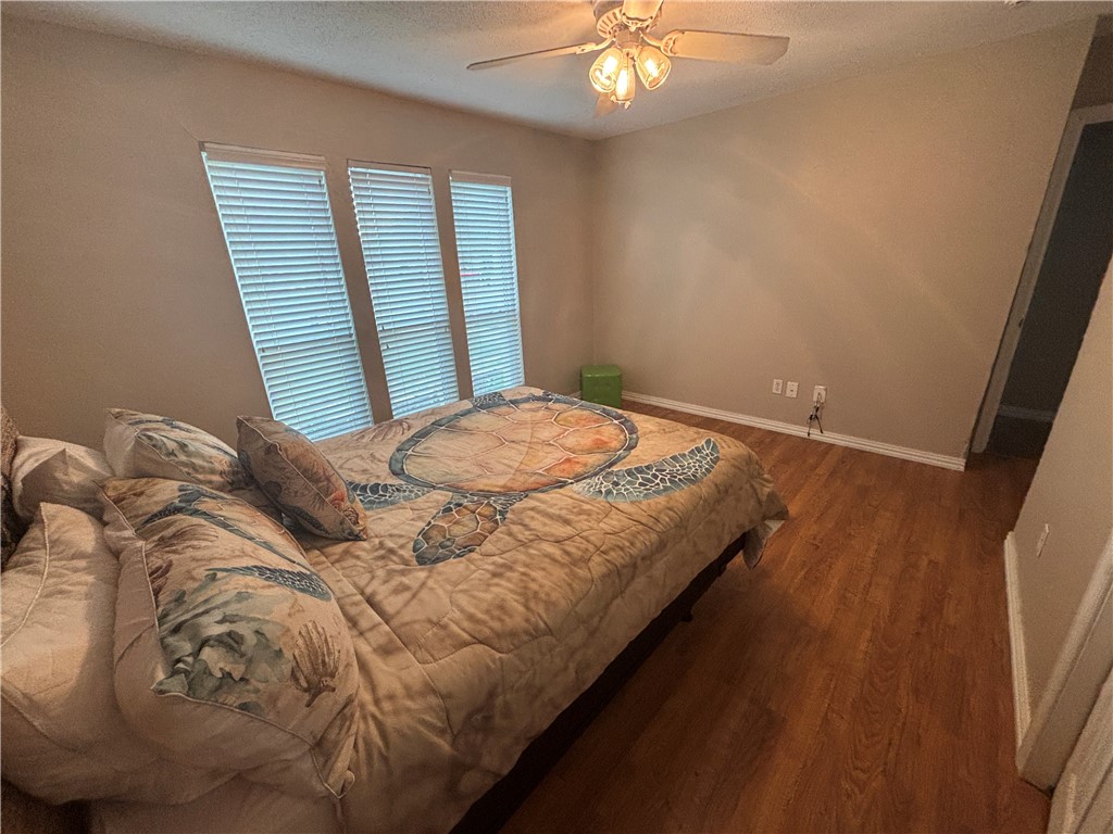 4957 Shadowbend Drive Corpus Christi, TX 78413 - Photo 28 of 35 a bedroom with a bed and a window