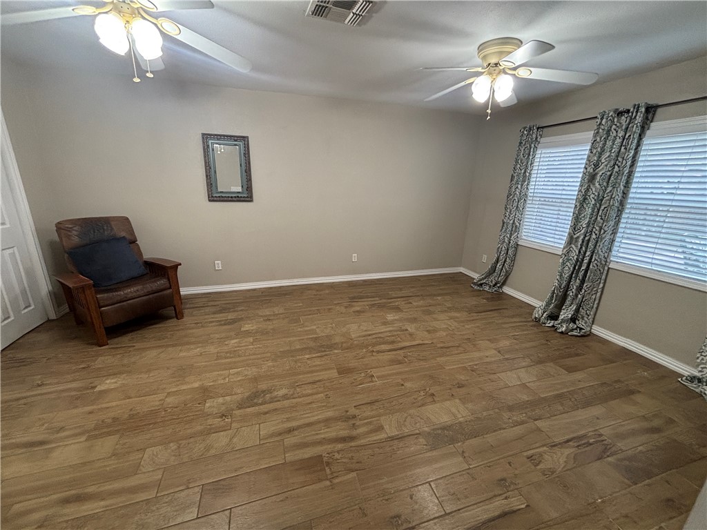 4957 Shadowbend Drive Corpus Christi, TX 78413 - Photo 33 of 35 an empty room with windows and fan