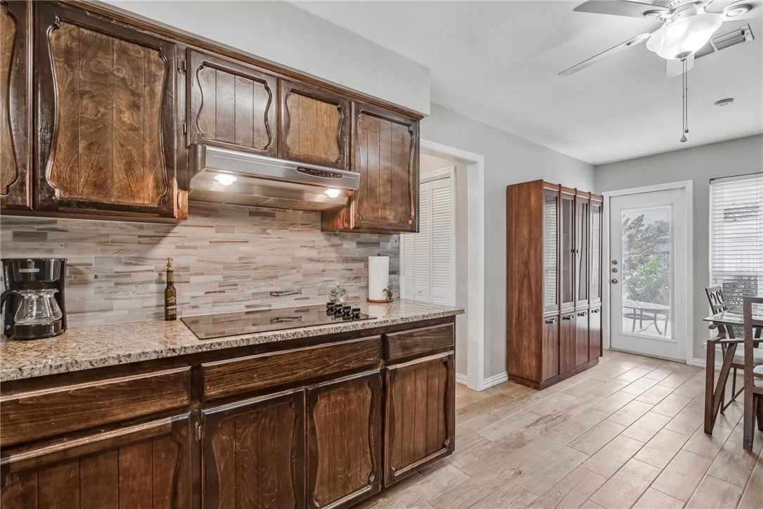 4957 Shadowbend Drive Corpus Christi, TX 78413 - Photo 5 of 35 a kitchen with stainless steel appliances granite countertop a refrigerator and a sink