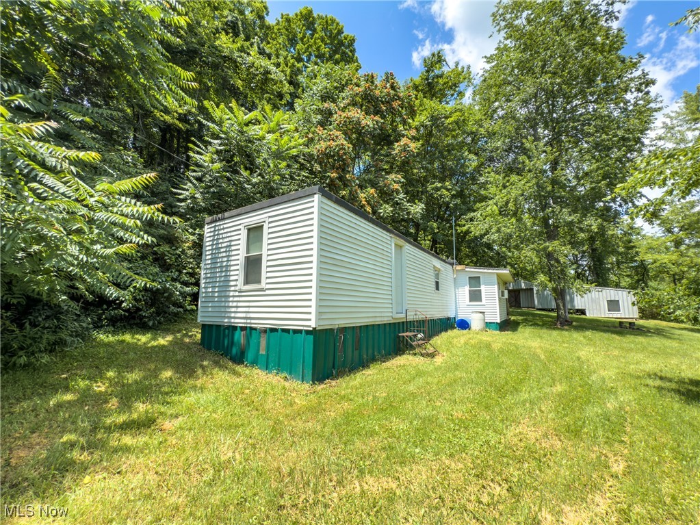 36475 Kinney Ridge Road Woodsfield, OH 43793 - Photo 29 of 50 View of side of property with a yard