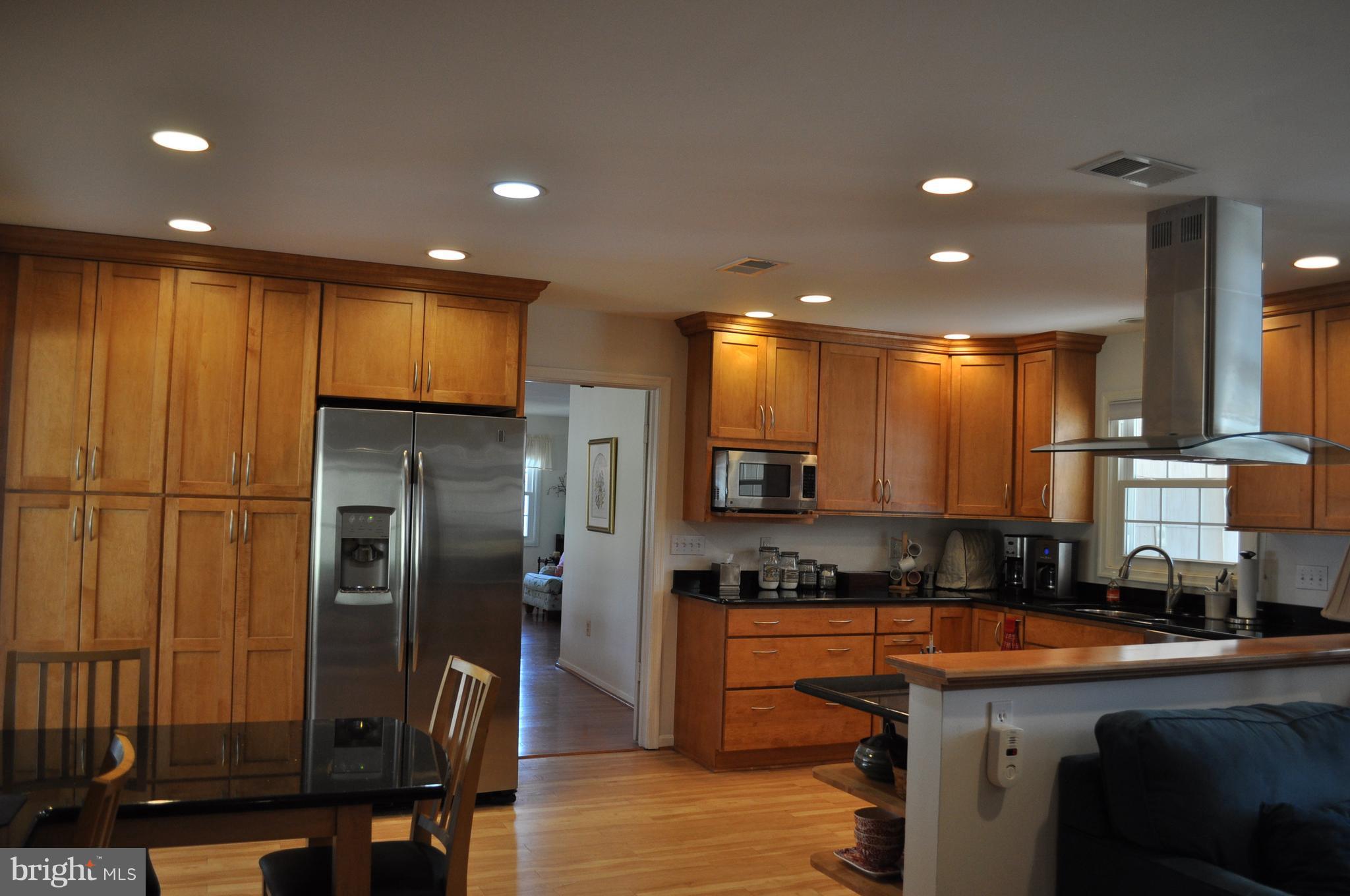 5159 Downwest Ride Columbia, MD 21044 - Photo 6 of 23 a kitchen with stainless steel appliances granite countertop a refrigerator a stove and a sink