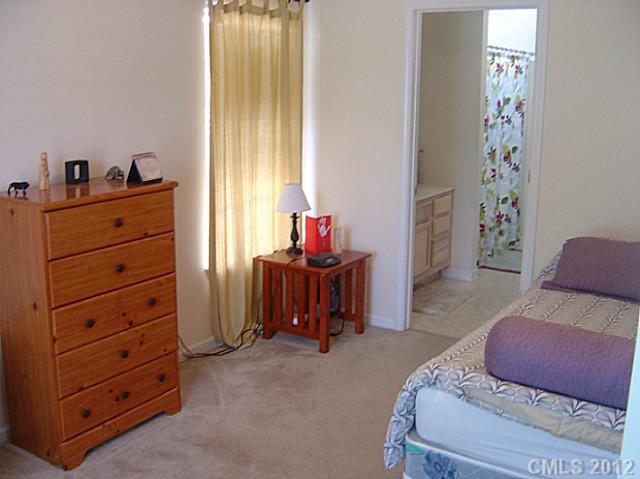 10118 Faires Farm Road Charlotte, NC 28213 - Photo 8 of 13 a living room with furniture closet and a window