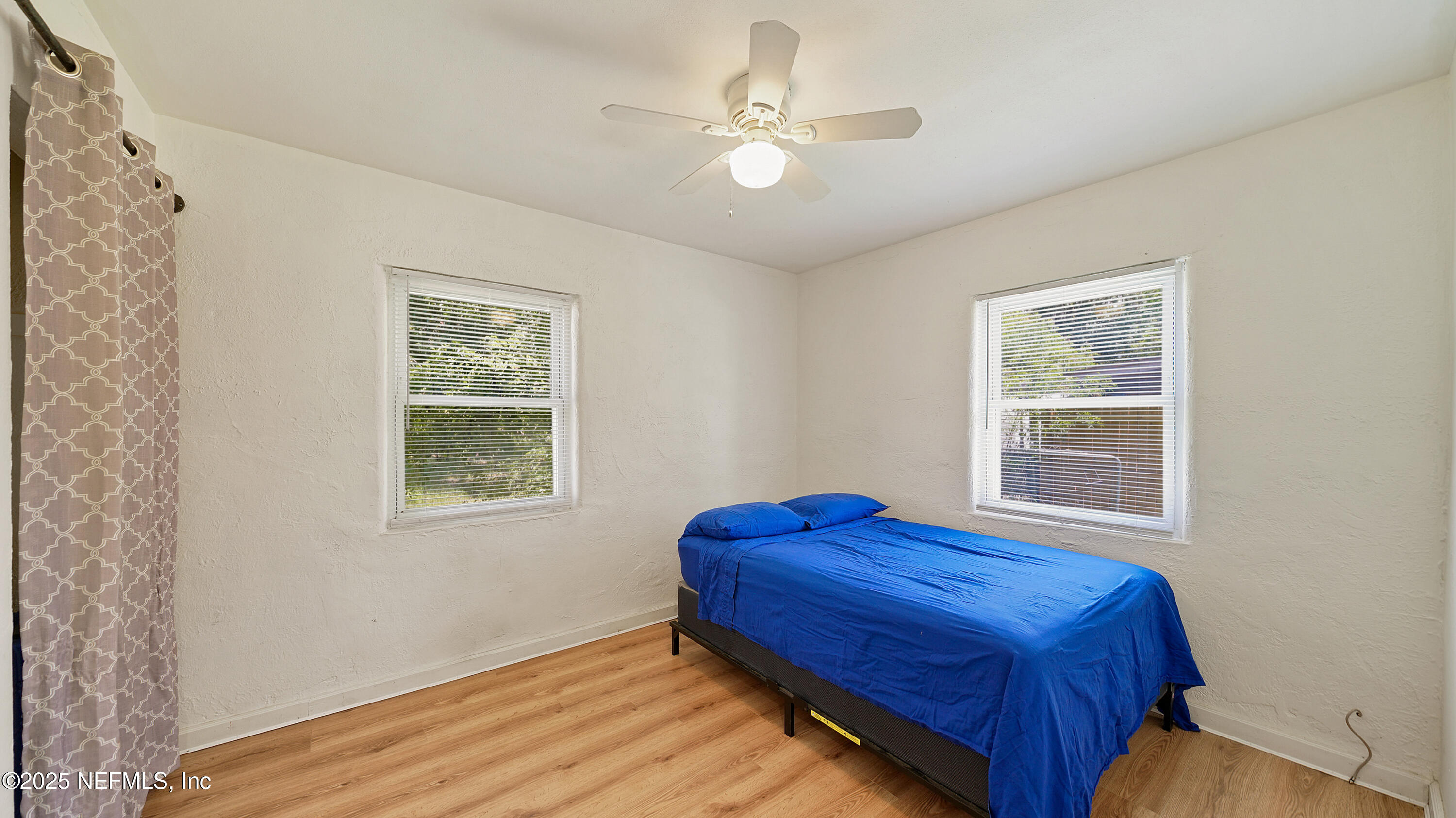 10555 Rutgers Road Jacksonville, FL 32218 - Photo 17 of 25 a bedroom with a bed and a window