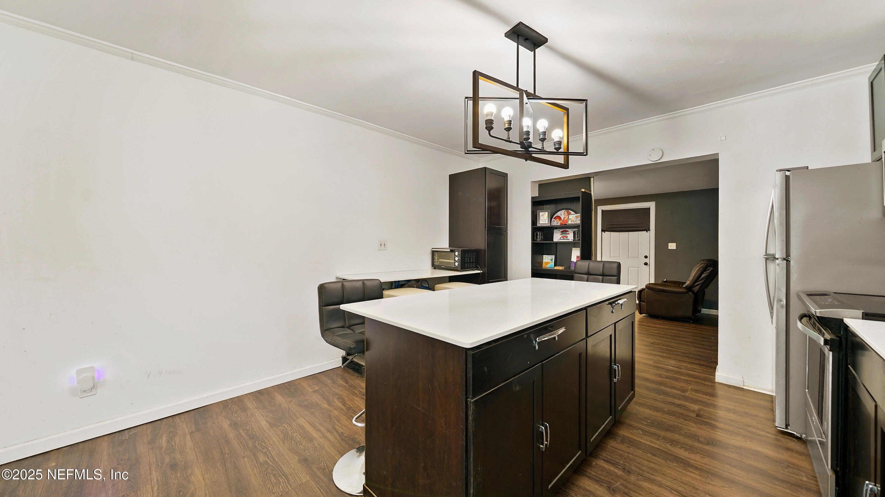 10555 Rutgers Road Jacksonville, FL 32218 - Photo 5 of 25 a kitchen with a sink a counter top space and stainless steel appliances