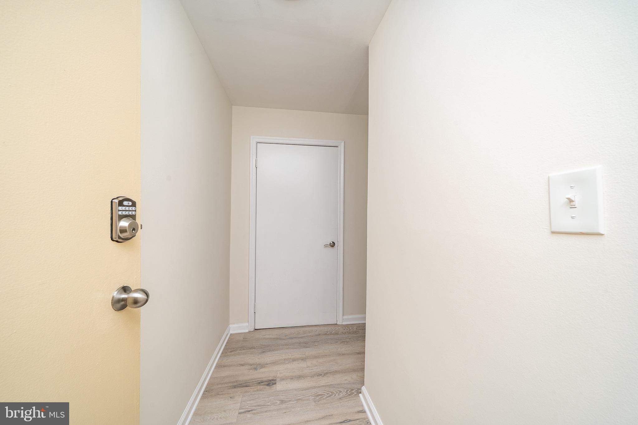 9910 Walker House Road, Unit 99104 Gaithersburg, MD 20886 - Photo 5 of 32 a view of a hallway
