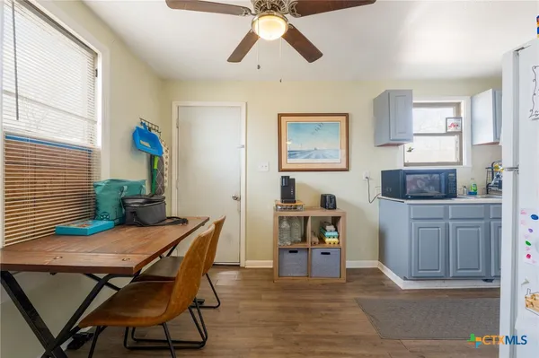 a view of a dining room with furniture and wooden floor
