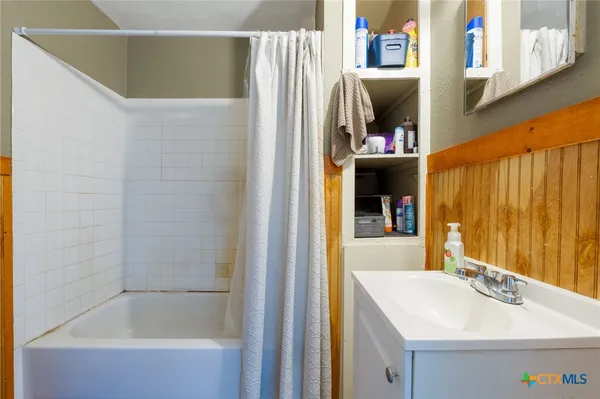a bathroom with a sink and a bathtub