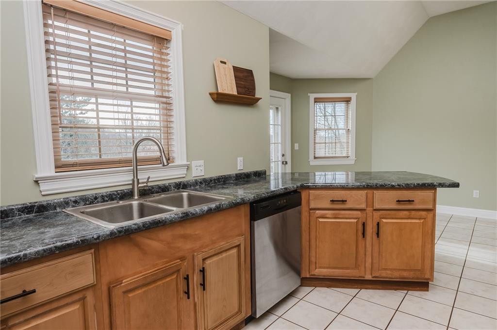 459 Forest Ridge Road Indiana, PA 15701 - Photo 15 of 45 a kitchen with granite countertop a sink and a granite counter tops
