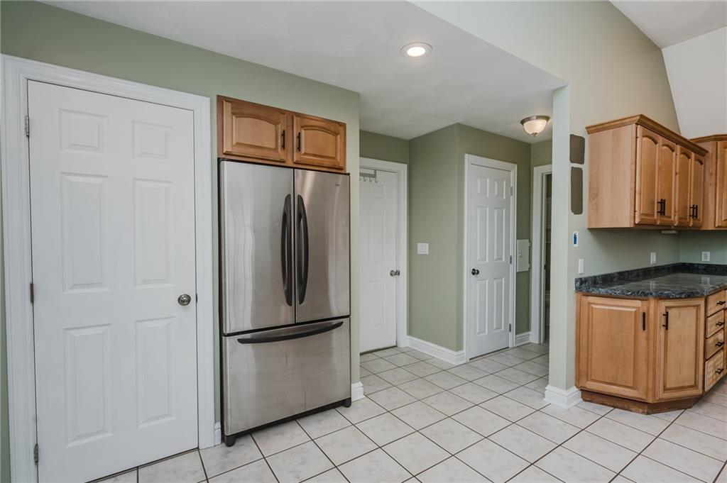 459 Forest Ridge Road Indiana, PA 15701 - Photo 17 of 45 a kitchen with stainless steel appliances granite countertop a refrigerator and a sink