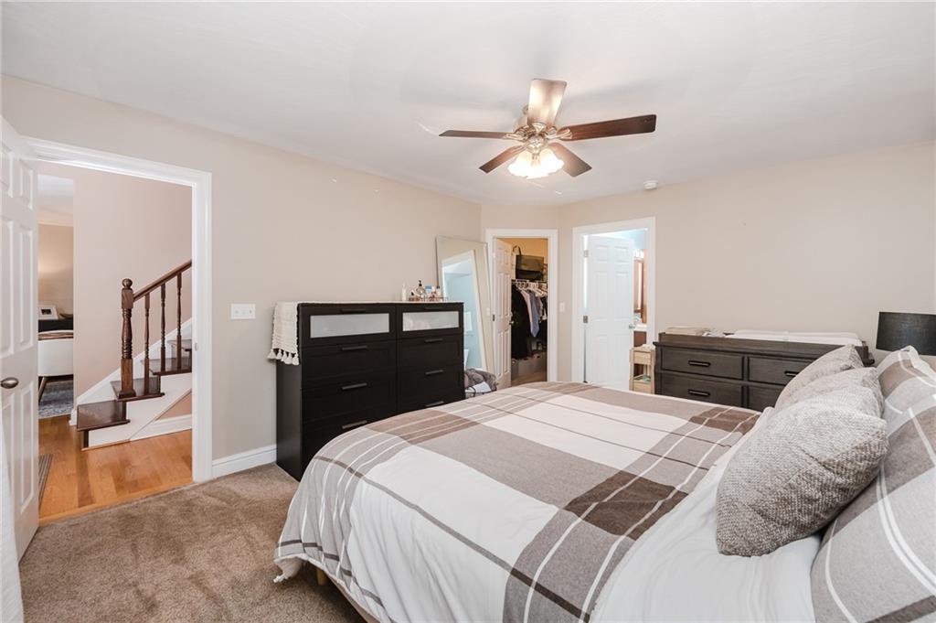 459 Forest Ridge Road Indiana, PA 15701 - Photo 20 of 45 a bedroom with a bed and a chandelier