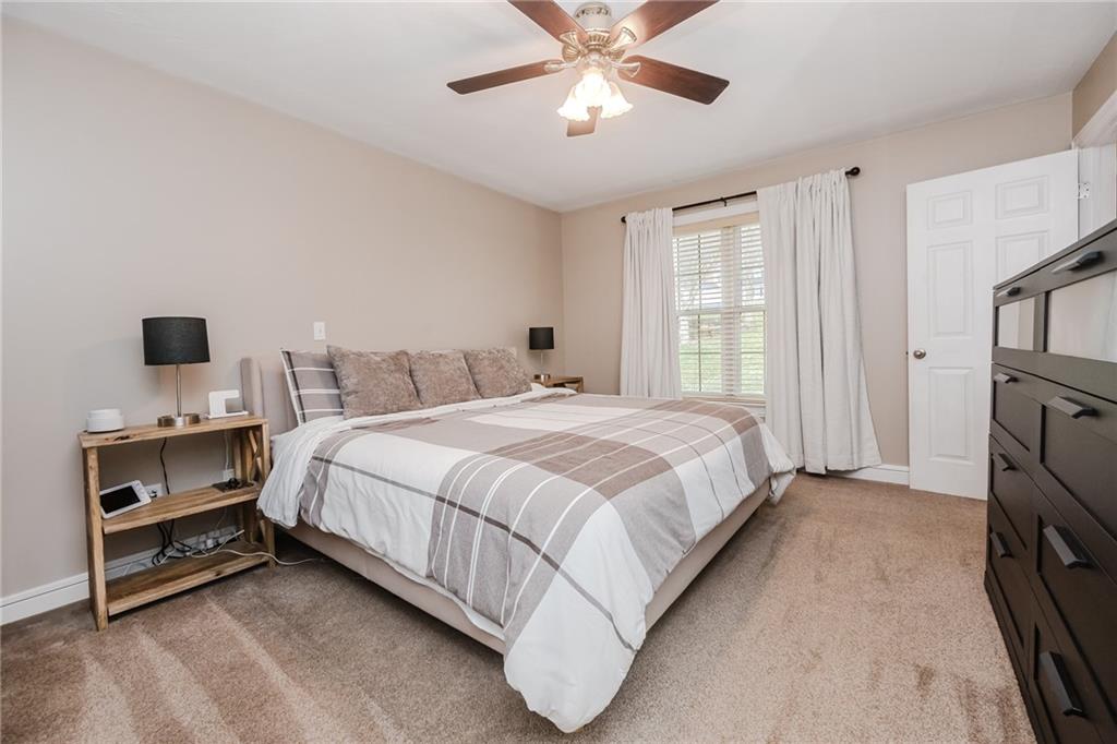 459 Forest Ridge Road Indiana, PA 15701 - Photo 21 of 45 a bedroom with a bed and a chandelier