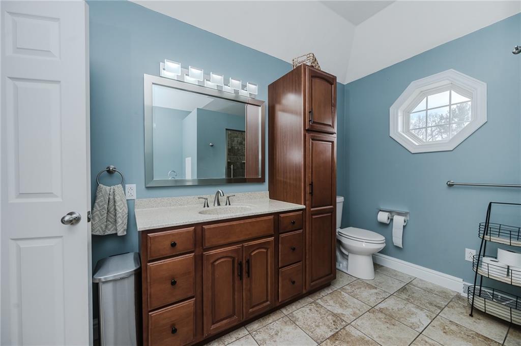459 Forest Ridge Road Indiana, PA 15701 - Photo 23 of 45 a bathroom with a toilet sink and mirror