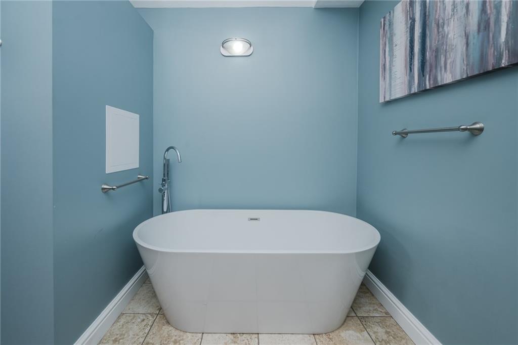 459 Forest Ridge Road Indiana, PA 15701 - Photo 24 of 45 a white bath tub sitting in a bathroom