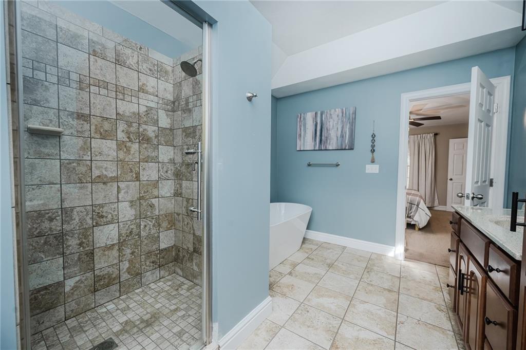 459 Forest Ridge Road Indiana, PA 15701 - Photo 25 of 45 a bathroom with a granite countertop sink a toilet and mirror