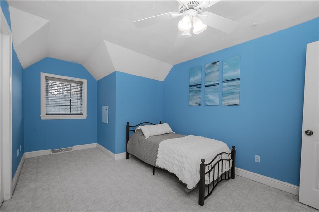 459 Forest Ridge Road Indiana, PA 15701 - Photo 33 of 45 a bedroom with a bed and a chandelier