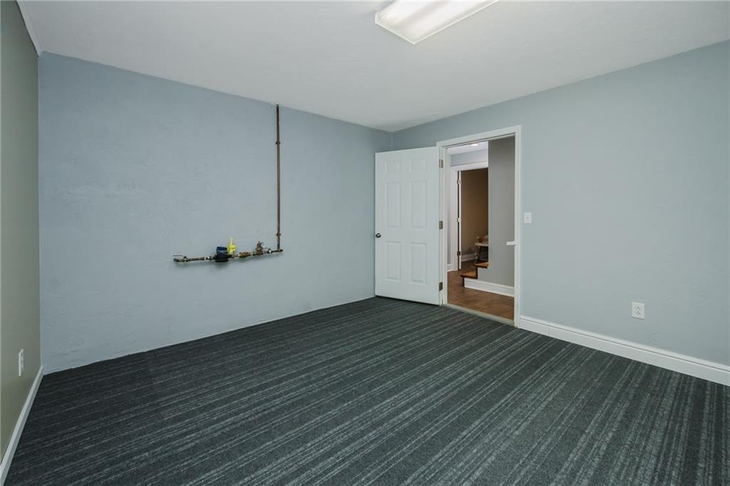 459 Forest Ridge Road Indiana, PA 15701 - Photo 44 of 45 a view of a room with wooden floor and bench