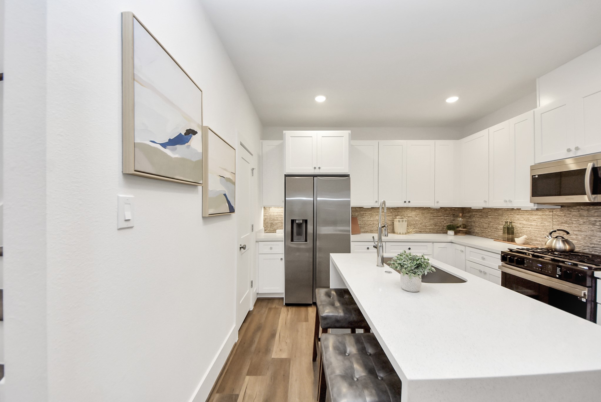 7502 Carver Road, Unit A Houston, TX 77088 - Photo 13 of 48 a kitchen with a refrigerator a sink and cabinets