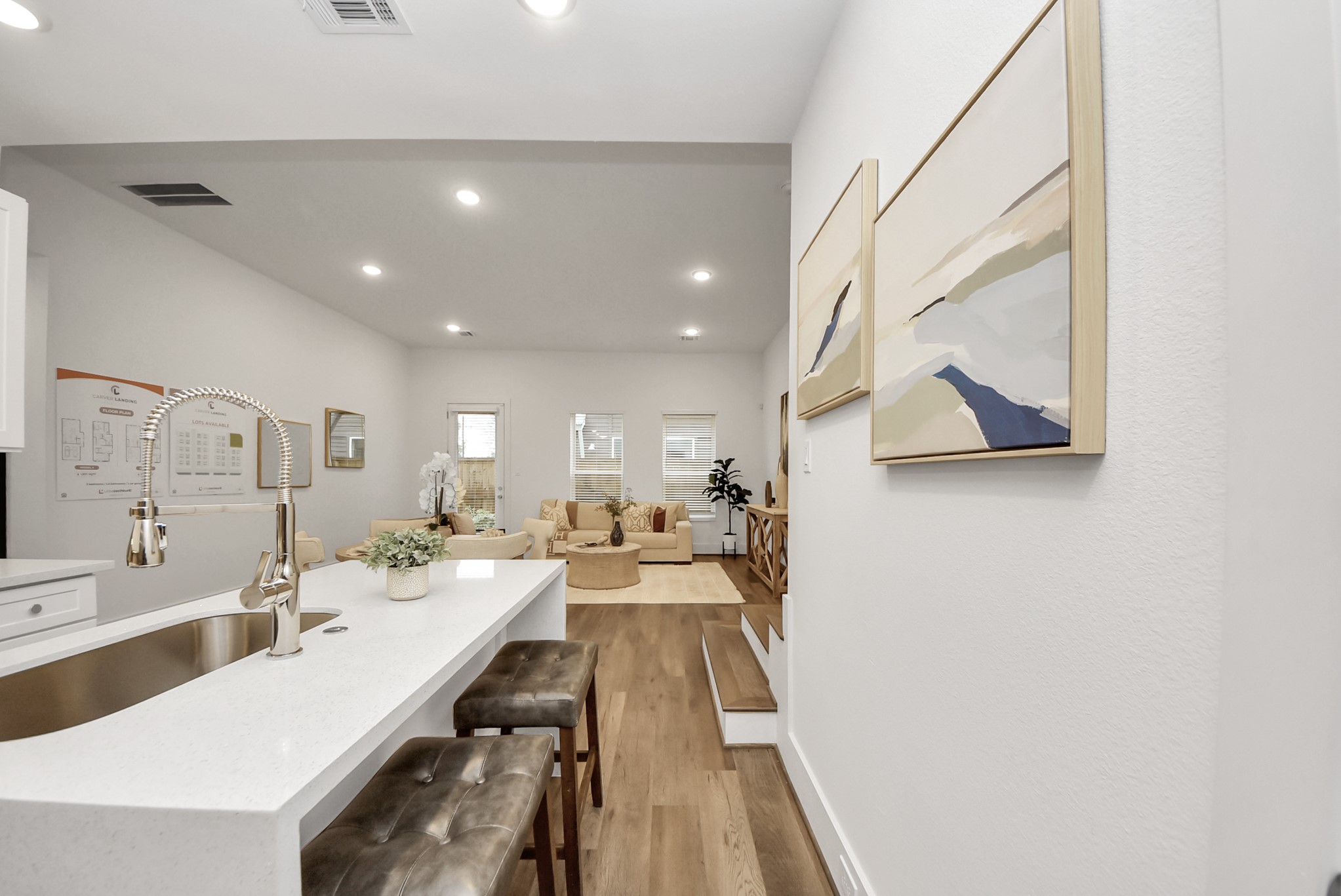 7502 Carver Road, Unit A Houston, TX 77088 - Photo 15 of 48 a large white kitchen with a lot of counter space a sink and a wooden floor