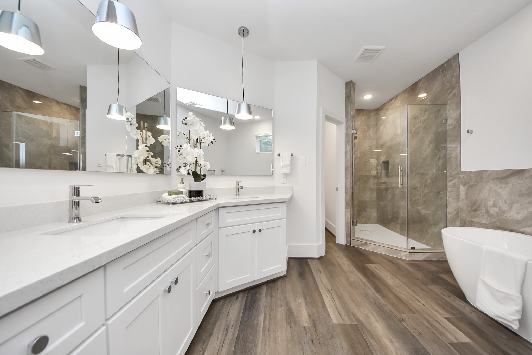 7502 Carver Road, Unit A Houston, TX 77088 - Photo 29 of 48 a spacious bathroom with sinks mirror and a shower