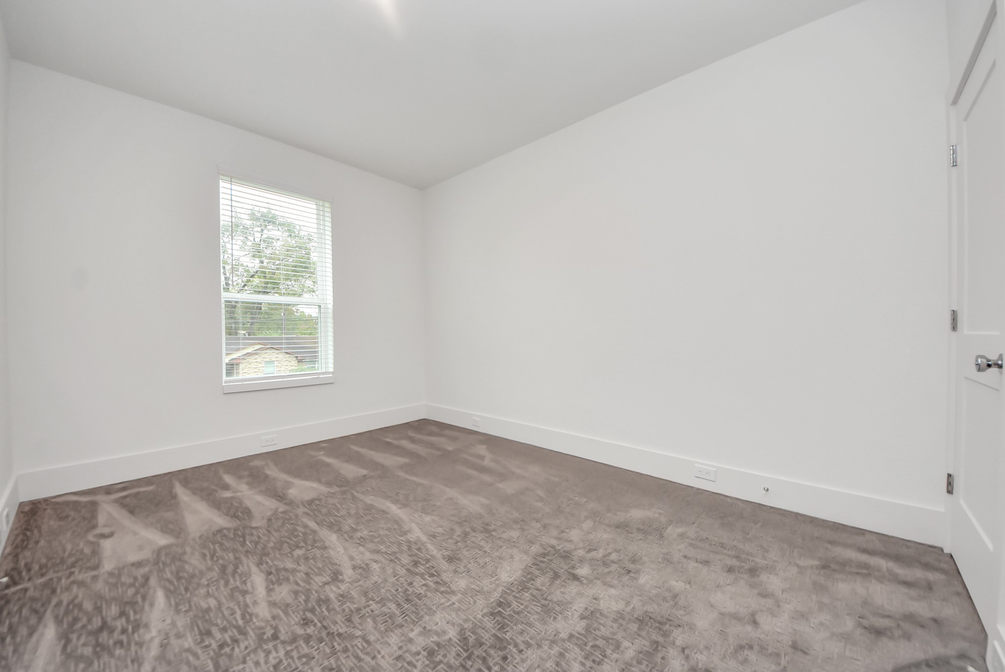 7502 Carver Road, Unit A Houston, TX 77088 - Photo 38 of 48 an empty room with windows