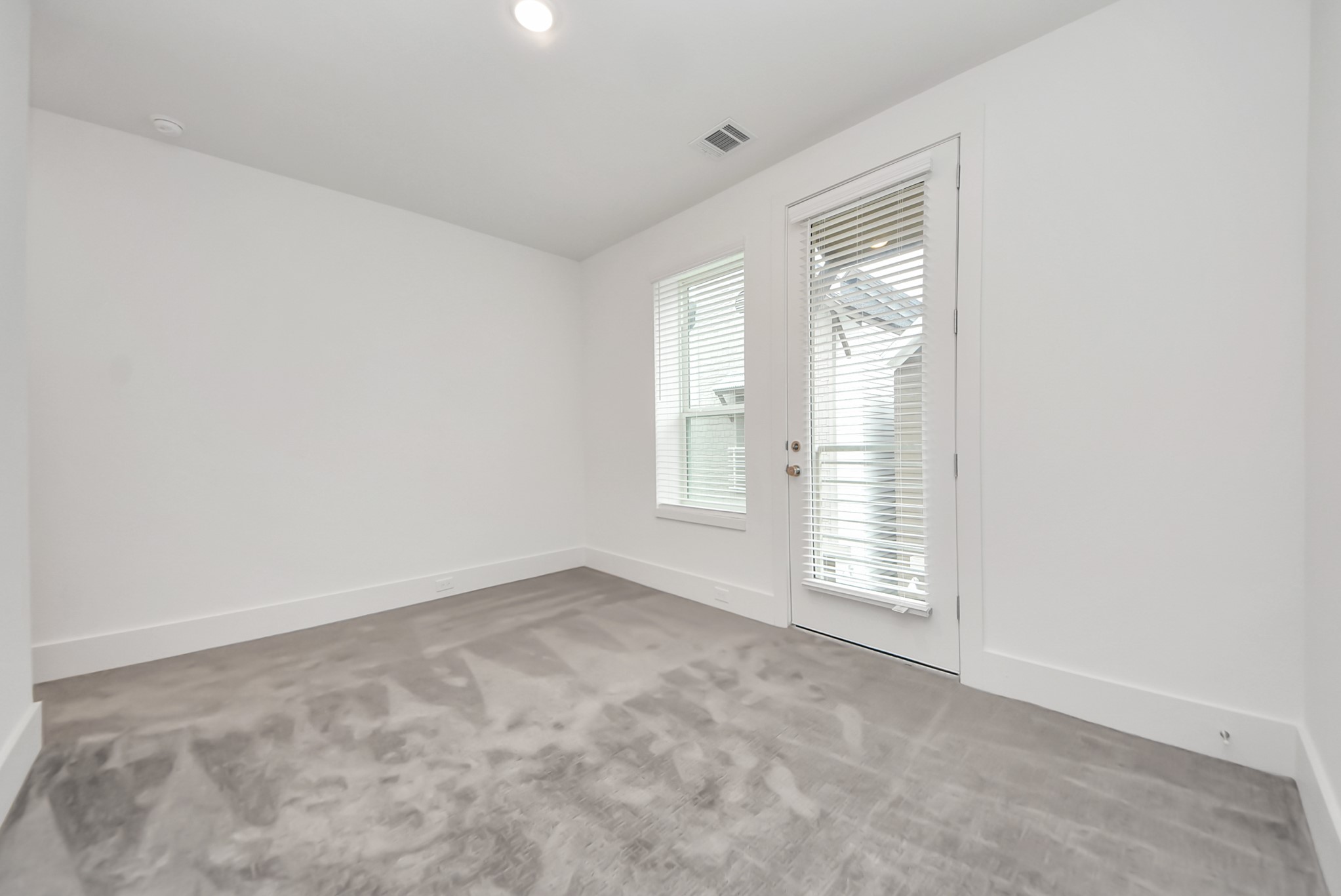 7502 Carver Road, Unit A Houston, TX 77088 - Photo 40 of 48 an empty room with windows